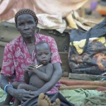 Angelina Awen sits with her granddaughter Aok in a camp for over 5,000 internally displaced persons in an Episcopal Church compound in Wau, South Sudan. Most of the families here were displaced by violence early in 2017, after a larger number took refuge in other church sites when widespread armed conflict engulfed Wau in June 2016.
As the rainy season approaches, they have no shelter, and sleep every night in the open.
Norwegian Church Aid, a member of the ACT Alliance, has provided relief supplies to the displaced in Wau, and has supported the South Sudan Council of Churches as it has struggled to mediate the conflict in Wau. South Sudan