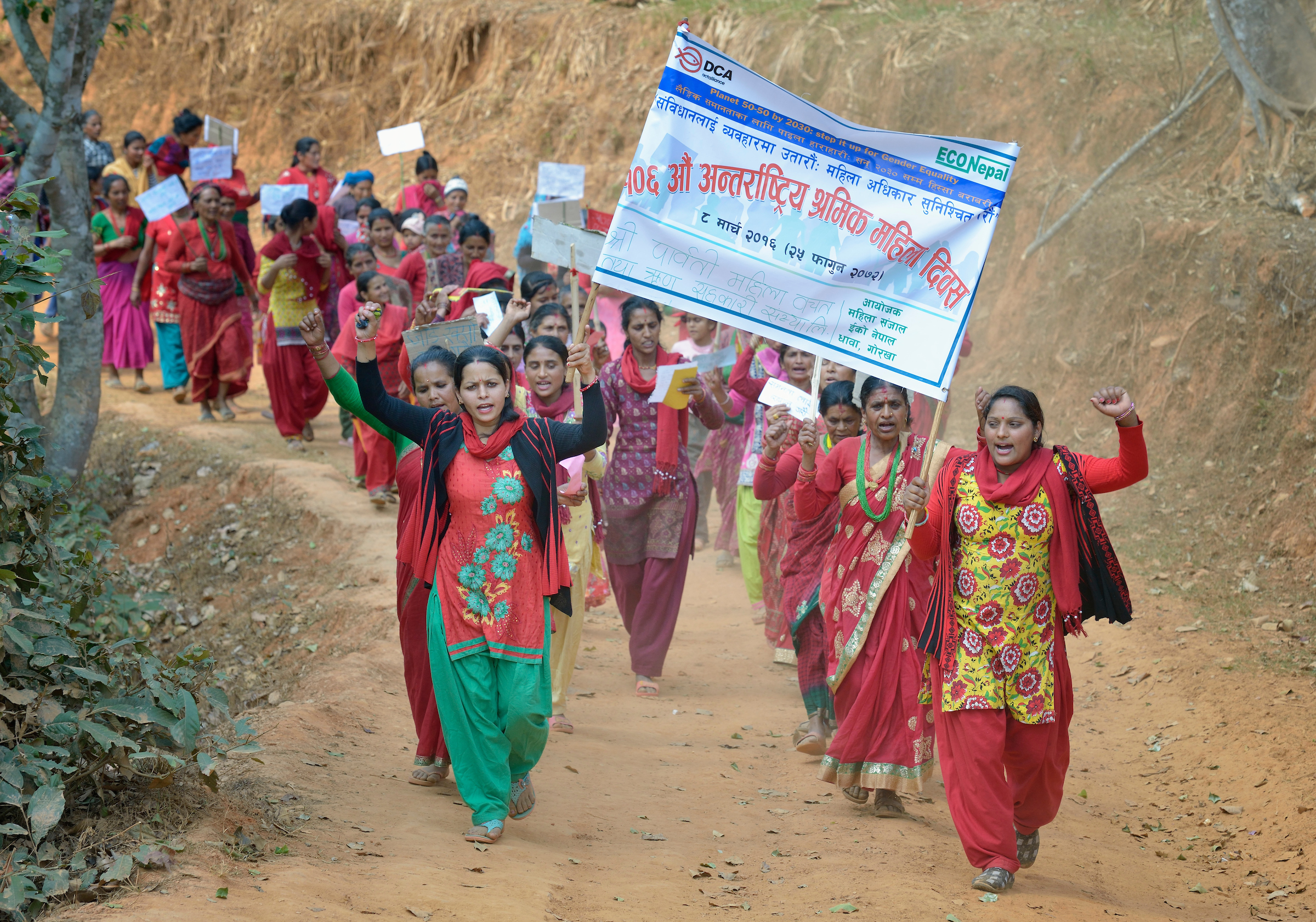 Women march together in celebration of International Women's Day on March 8, 2016, in Dhawa, a village in the Gorkha District of Nepal. Photo: Paul Jeffrey