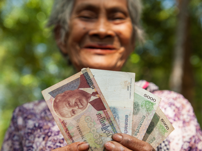 ‘I plan to use this grant money to buy a sack of rice for my family," said Lim Ean (79), from Cambodia. ACT members provide CASH transfer in several emergency responses. Photo: Paul Jeffrey