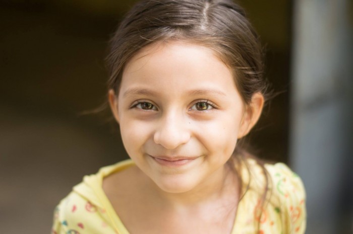 Catharin, eight years old, is the youngest moderator on a community radio in Cara Sucia, El Salvador, severely affected by Climate Change. Photo: Valter Hugo Muniz