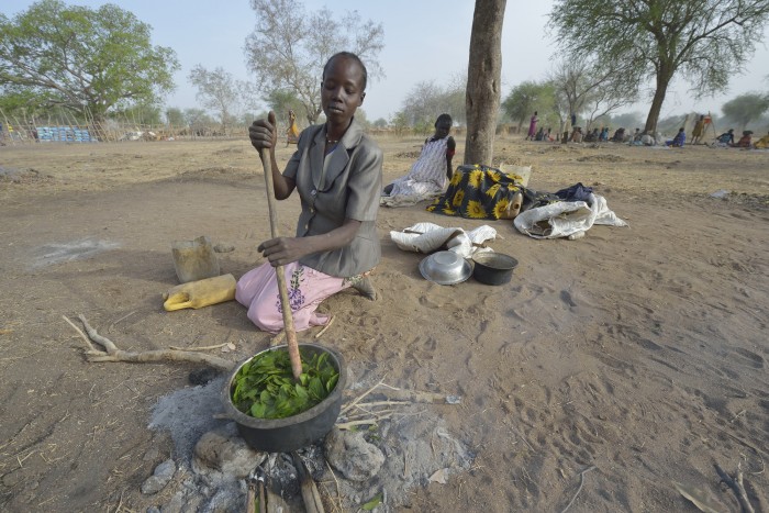 Nidier Atak cooks wild leaves in Rumading, a village in South Sudan's Lol State where more than 5,000 people, displaced by drought and conflict, remain in limbo. Atak and her five children left their home in Wanalel in January 2017 after successive crop failures left them with no other options. They set out walking for Sudan, seeking better conditions, but stopped at Rumading when they met others who had been violently turned back at the border. So they remain camped out under trees, eating wild leaves as the rainy season approaches. Her husband had left home looking for work months earlier, and she doesn't know where he is. In early April, Norwegian Church Aid, a member of the ACT Alliance, began drilling a well in the informal settlement and distributed sorghum, beans and cooking oil to the most vulnerable families. It is carrying out the emergency assistance in coordination with government officials and the local Catholic parish. South Sudan