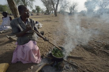 Nidier Atak cooks wild leaves in Rumading, a village in South Sudan's Lol State where more than 5,000 people, displaced by drought and conflict, remain in limbo. Atak and her five children left their home in Wanalel in January 2017 after successive crop failures left them with no other options. They set out walking for Sudan, seeking better conditions, but stopped at Rumading when they met others who had been violently turned back at the border. So they remain camped out under trees, eating wild leaves as the rainy season approaches. Her husband had left home looking for work months earlier, and she doesn't know where he is. In early April, Norwegian Church Aid, a member of the ACT Alliance, began drilling a well in the informal settlement and distributed sorghum, beans and cooking oil to the most vulnerable families. It is carrying out the emergency assistance in coordination with government officials and the local Catholic parish. South Sudan