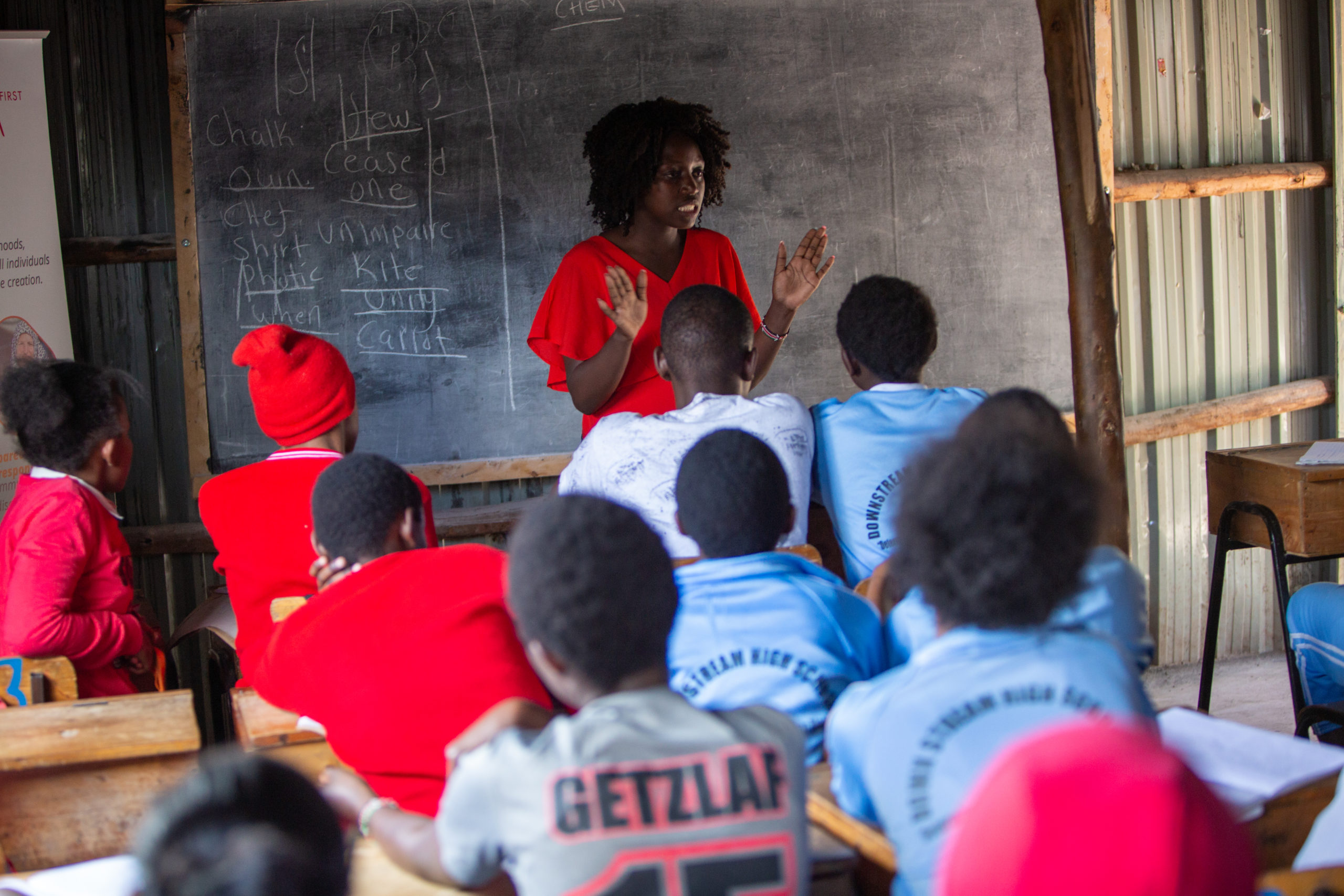 Lilian Mutheu speaking to a group during a DREAMS session in Mukuru Kwa Njenga. Photo: Sean Hawkey/ACT