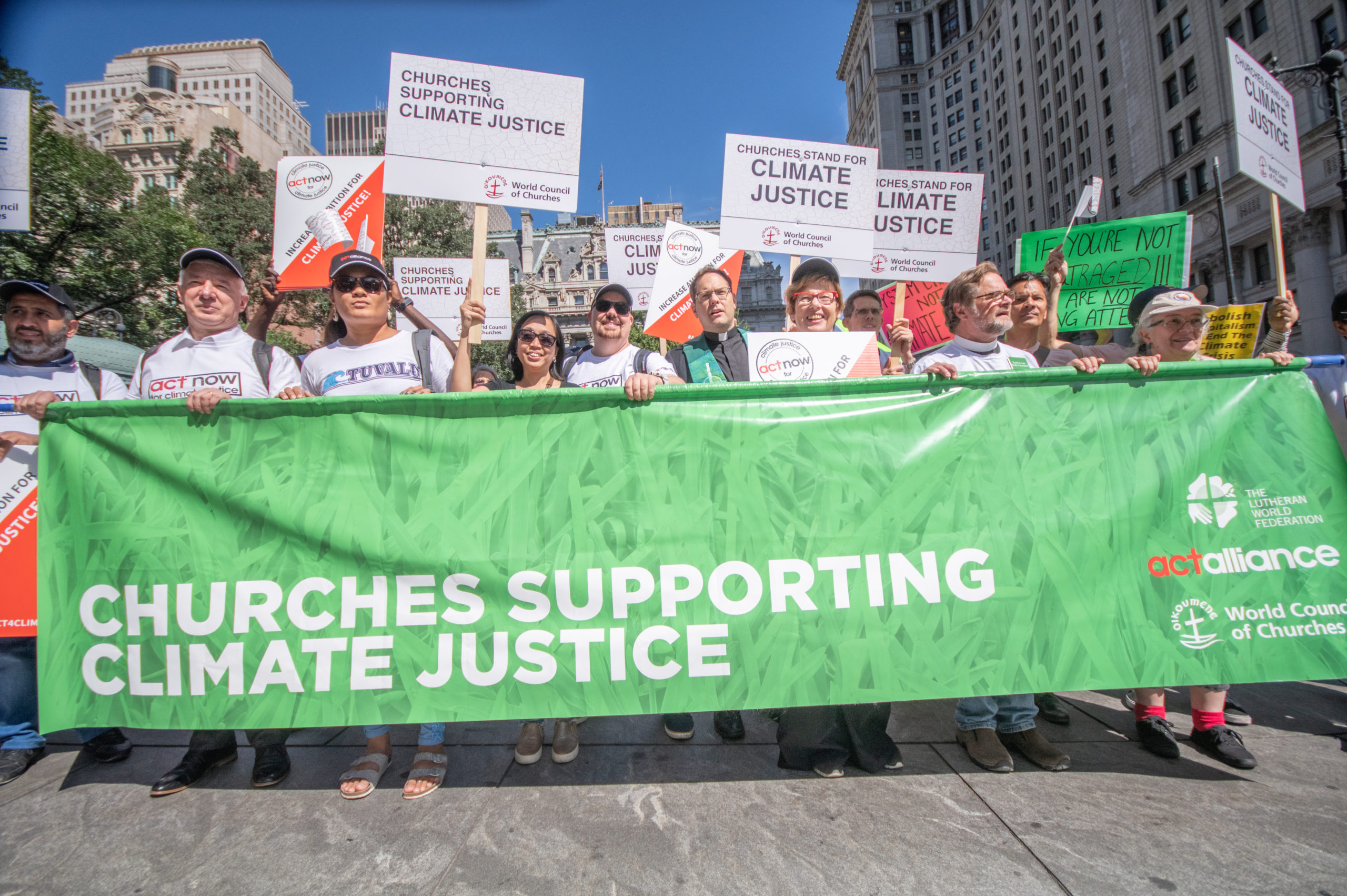 Churches supporting climate justice banner
